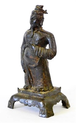 Lot 120 - A Copper Alloy Figure of a Dignitary, in Ming style, standing wearing flowing robes on a...