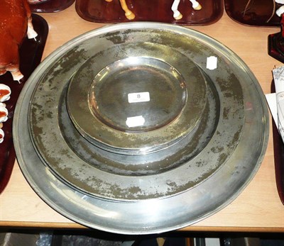 Lot 8 - Five pewter chargers and six crested pewter plates