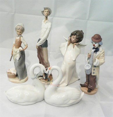 Lot 19 - Lladro figures - 'Girl Washing', 'Sad Sax', 'Don Quixote', two swans and an angel (5)