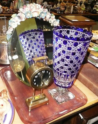 Lot 40 - A Barbola mirror, a blue flashed cut glass vase and a brass gravity clock