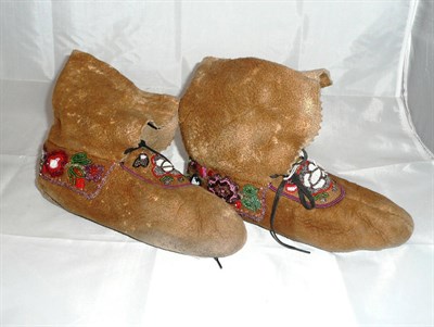 Lot 50 - A pair of Woodlands India hide moccasins, possibly Iraquois