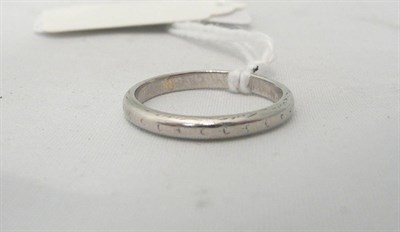 Lot 57 - A band ring stamped 'PLAT'