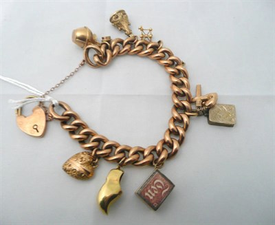 Lot 62 - Curb bracelet hung with charms