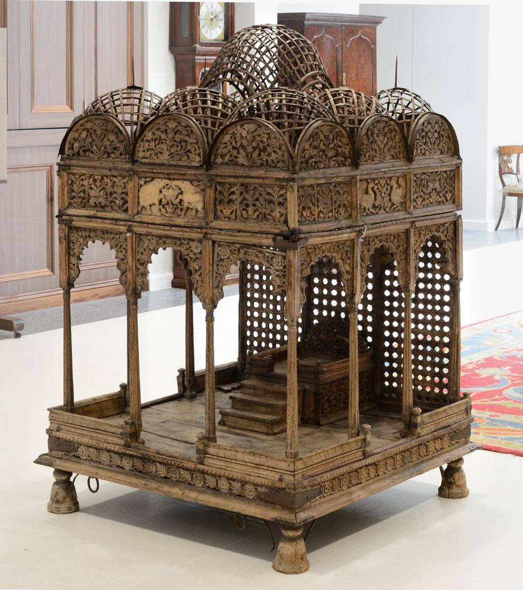 Lot 128 - An Indian Carved Teak Shrine, probably 17th century, in the form of a miniature temple, the...