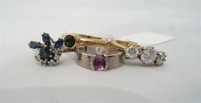 Lot 74 - A 14ct gold sapphire and diamond ring, two 9ct gold rings and another ring