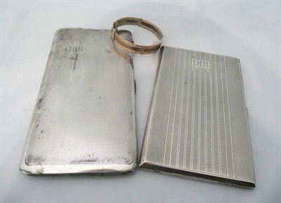 Lot 91 - Silver cigarette case, plated cigarette case and a white and yellow metal bangle (3)