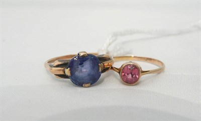 Lot 95 - A blue sapphire ring (stone scuffed) and a pink coloured spinel ring