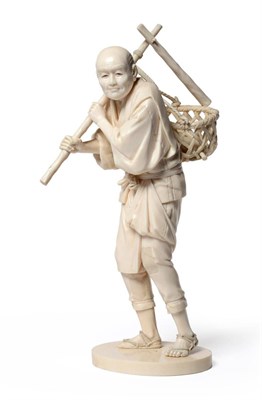 Lot 131 - A Japanese Ivory Okimono, Meiji period, as a farmer standing wearing traditional costume...