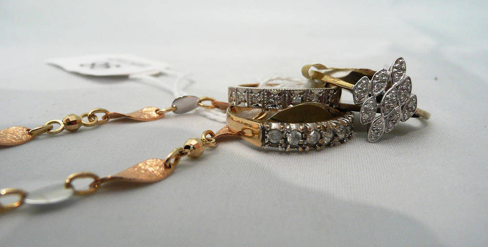 Lot 98 - Three 9ct gold diamond rings, and a 9ct two colour bracelet