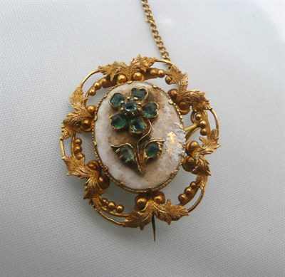 Lot 99 - An emerald set mourning brooch - enamel damaged and locket panel (cracked)