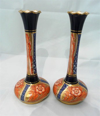 Lot 121 - A pair of MacIntyre vases with gilt decoration (one a.f.)
