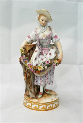 Lot 124 - A late 19th century Meissen figure of a lady with flowers