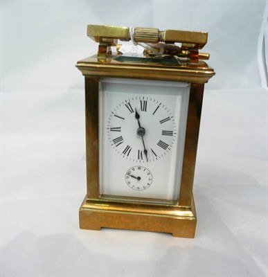 Lot 129 - A brass carriage timepiece and alarm