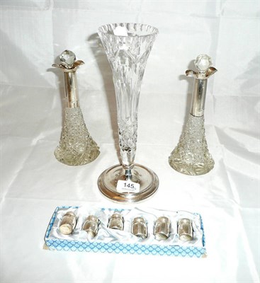 Lot 145 - Set of six sterling silver pepperettes, silver collared and glass bottles and a silver footed glass