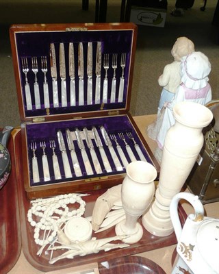 Lot 169 - A mahogany cased set of mother of pearl and plated fruit knives and forks, an ivory necklace, ivory