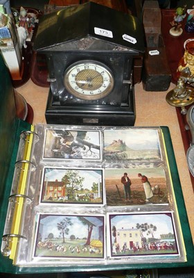 Lot 173 - A Belgian black slate mantel timepiece and an album of postcards