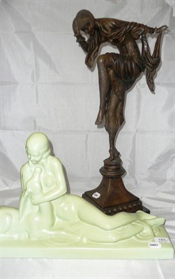 Lot 183 - A bronzed resin Art Deco Style dancing girl and a green glazed pottery figure of a reclining nude