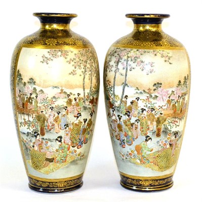 Lot 140 - A Pair of Satsuma Earthenware Baluster Vases, Meiji period, with everted rims, painted with...