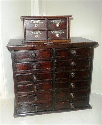 Lot 239 - A stained pine chest of twelve drawers and a Victorian set of spice drawers