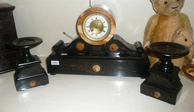 Lot 240 - A late 19th century three piece clock garniture