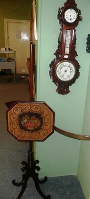 Lot 244 - A Victorian carved oak barometer mounted with a thermometer and a clock and also a pole screen
