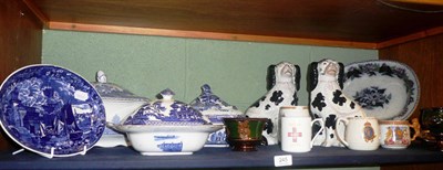 Lot 245 - A shelf including a pair of black and white Staffordshire dogs, three blue and white tureens etc
