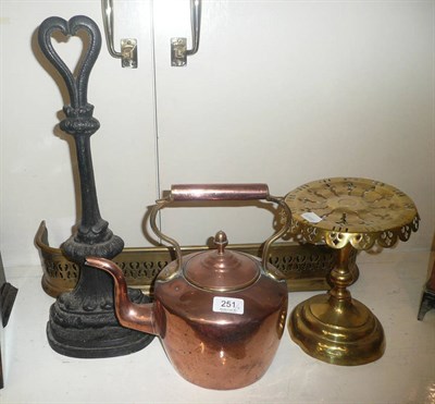 Lot 251 - Cast door stop, copper kettle, trivet and a curb