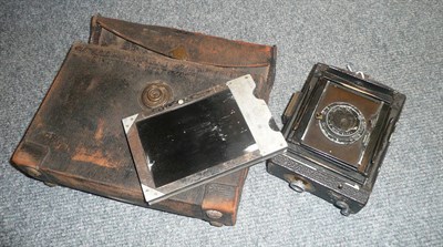 Lot 261 - An Ica 'Minimum Palmos' compact folding bed plate camera No.10024, with black leather covered body