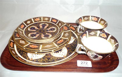 Lot 272 - Four Royal Crown Derby plates, two tea cups and saucers