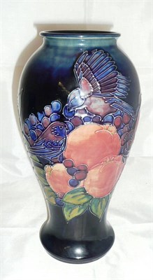 Lot 276 - A Walter Moorcroft `Finches' pattern vase (second)