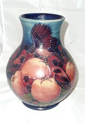 Lot 277 - A Walter Moorcroft `Finches' pattern vase