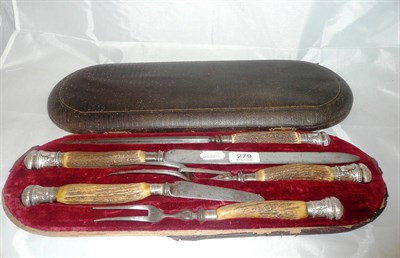 Lot 279 - A silver mounted carving set with antler handles