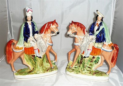 Lot 304 - A pair of Staffordshire equestrian figures