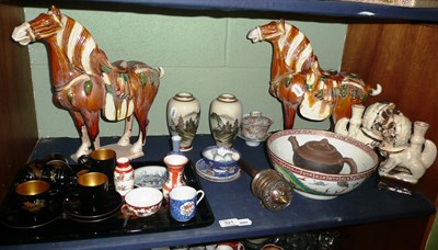 Lot 321 - A shelf of Oriental ceramics and works of art including a pair of Chinese tilework Tang style...