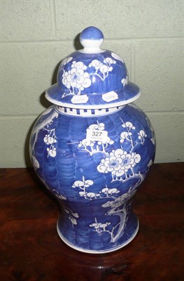 Lot 327 - A Chinese blue and white prunus decorated vase and cover