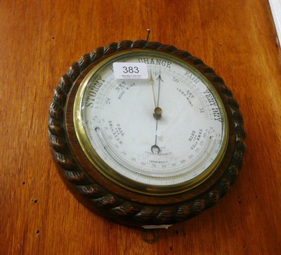 Lot 383 - A 19th century barometer/thermometer with carved rope twist border