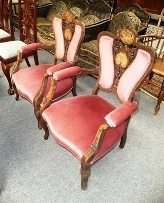 Lot 519 - A pair of late Victorian inlaid mahogany open armchairs upholstered in pink velour