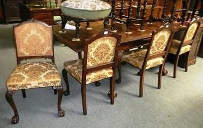 Lot 534 - Set of six oak dining chairs upholstered in gold fabric including draw leaf dining table