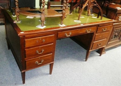 Lot 544 - Cooke's of London mahogany desk with green leather top