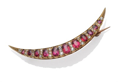 Lot 179 - A Ruby and Diamond Crescent Brooch, circa 1880, the graduated oval mixed cut rubies alternate...