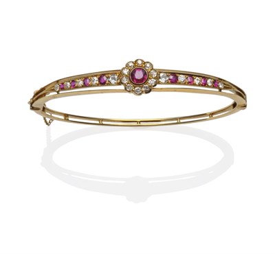 Lot 180 - A Ruby and Diamond Bangle, circa 1880, a ruby and diamond cluster in yellow rubbed over...