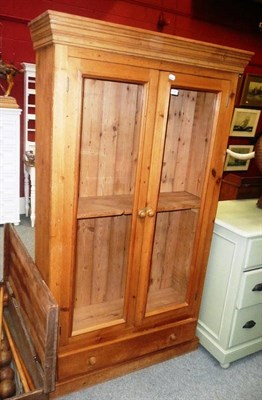 Lot 654 - Two door glazed pine bookcase