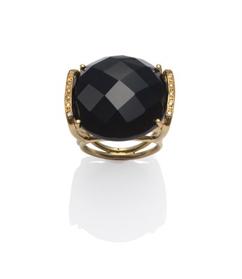 Lot 188 - An Onyx and Diamond Ring, a round faceted onyx in a bar setting, with round brilliant cut diamonds