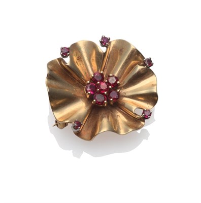 Lot 191 - A Flower Brooch, by Tiffany & Co., circa 1960, as a stylised flower, with a cluster of rubies...