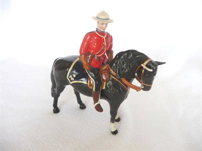 Lot 1057 - Beswick "Canadian Mountie" on Black Horse, model No. 1375, gloss, 21cm high (restorations)