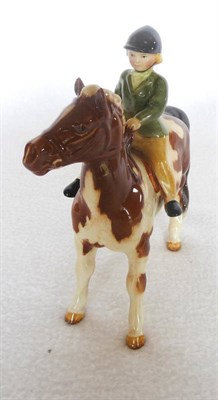 Lot 1087 - Beswick "Girl on Pony", model No.1499, skewbald, 14cm high