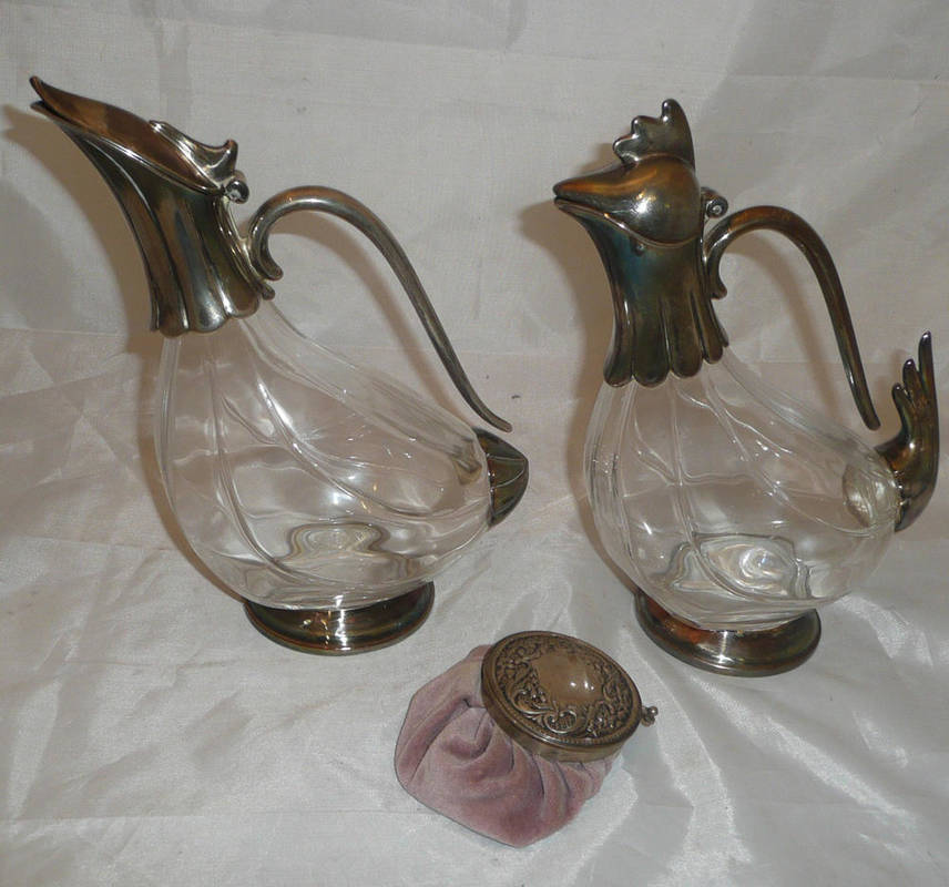 Lot 4 - A pair of Italian glass 'cock and hen' claret jugs with plated mounts, an Italian 800 standard...
