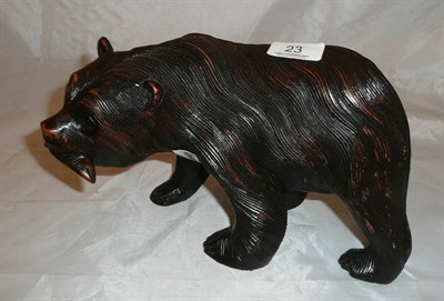 Lot 23 - A carved wooden figure of a bear