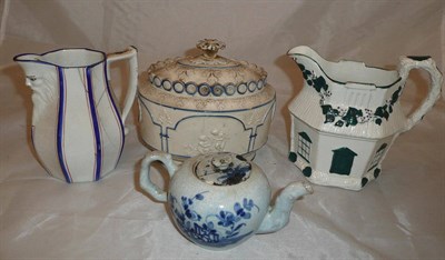 Lot 32 - A Delft teapot, a lidded sucrier and two jugs