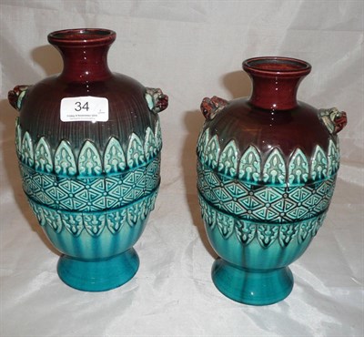 Lot 34 - Two similar Chinese vases decorated in turquoise and sang de boeuf glazes